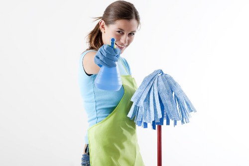 Professional carpet cleaner preparing equipment for a home cleaning appointment