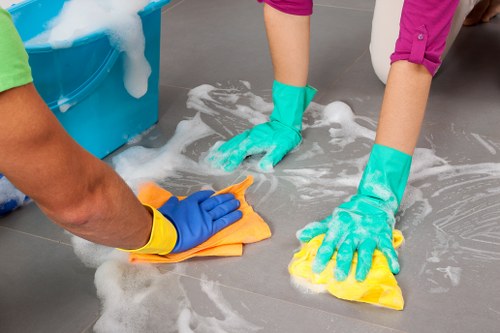 Professional hot water extraction cleaning a residential carpet